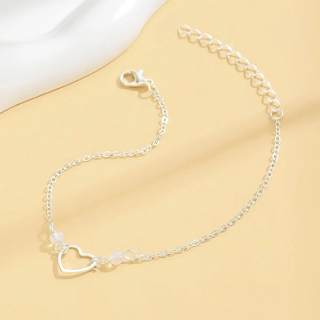 Gold or silver adjustable alloy anklet for women featuring a heart-shaped pendant.