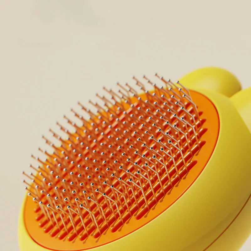 Green self-cleaning pet grooming brush with stainless steel comb and a release button on the handle.