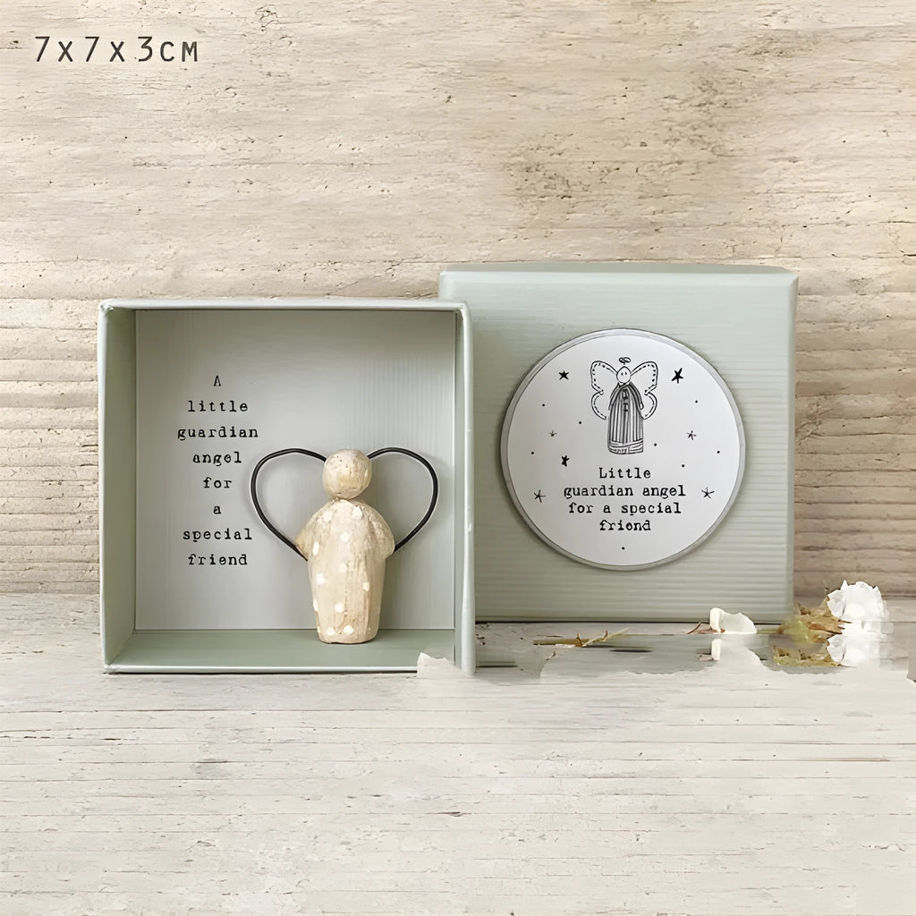 Boxed cartoon-style Guardian Angel ornament figurine on a white background.