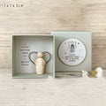 Boxed cartoon-style Guardian Angel ornament figurine on a white background.
