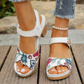 White women's high heel sandals with a velcro strap closure and rubber sole.