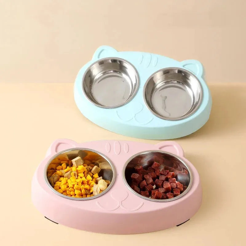 Blue plastic double bowl pet feeder tray for cats and small dogs on a floor.