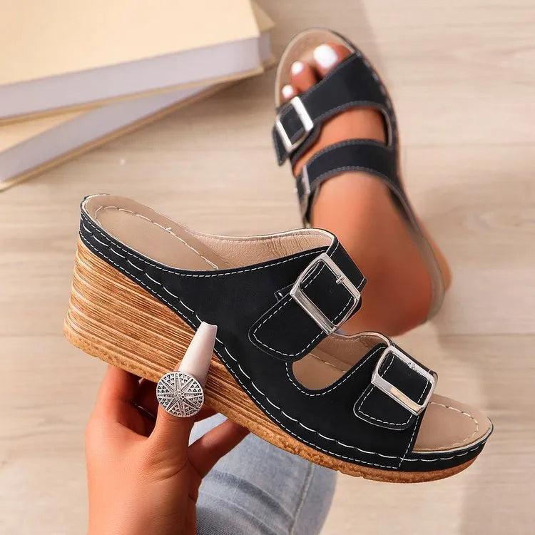 Women's creamy-white wedge beach slippers with an adjustable belt buckle strap and rubber sole