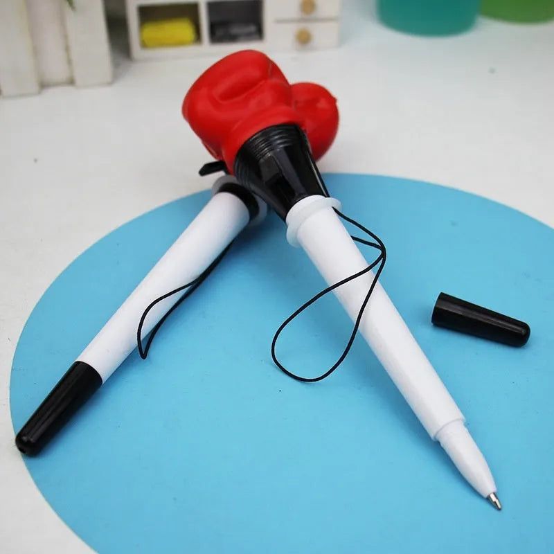 Set of four black boxing press ejection pens with bullet-shaped 0.7mm tips on a white surface.