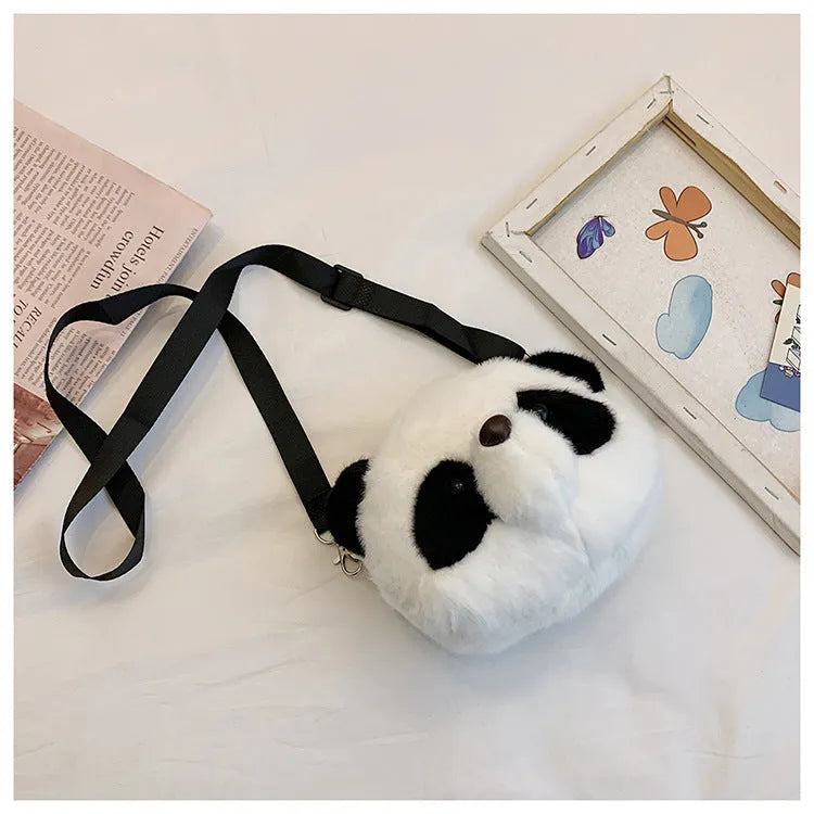 Soft plush crossbody bag with panda head design, cylindrical shape, and an outer sandwich pocket.