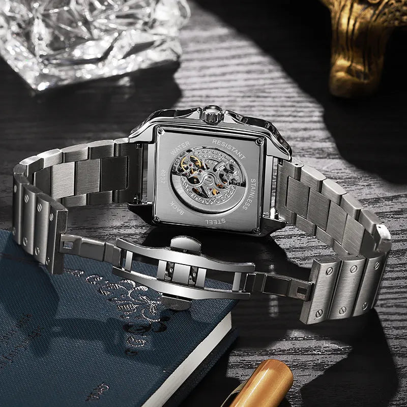 Square automatic watch for men with diamond detailing on a black leather strap.