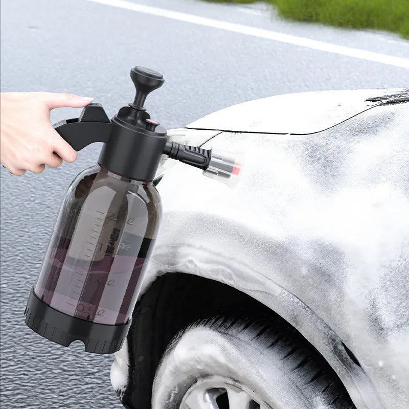Black 2L plastic foam watering can sprayer with pump handle and two nozzles for car washing and gardening.