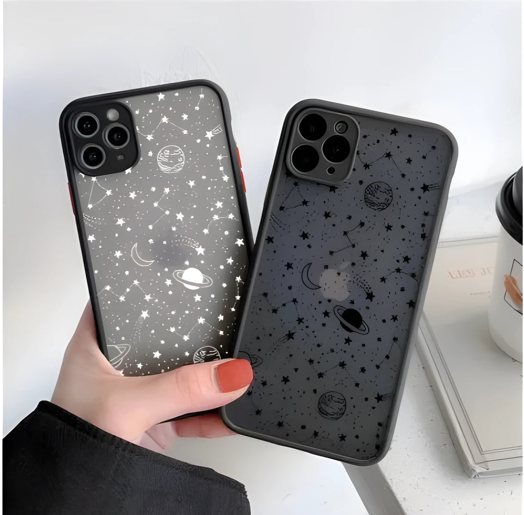 Star universe patterned black iPhone case on a mobile phone, showing raised edges around the screen and camera.