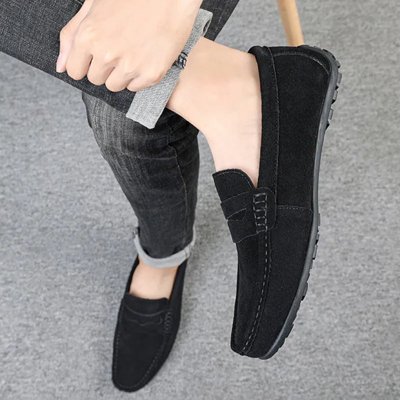 Men's brown suede slip-on loafers with round toe and flat rubber sole