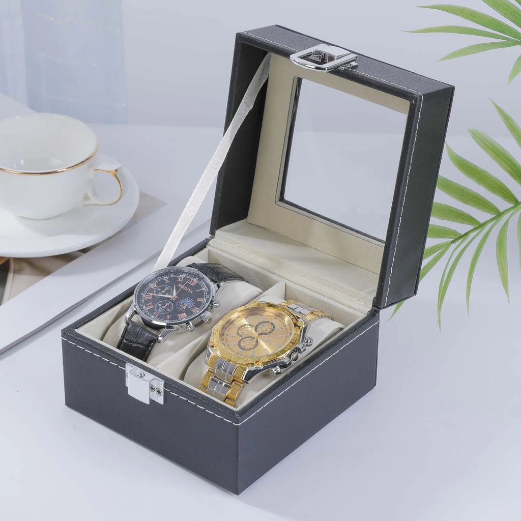 Grey leather watch storage box with transparent lid showing watch cushions inside.