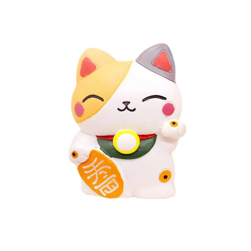 Black and white resin fortune cat decorative clip for car air conditioning vent with aromatherapy function.