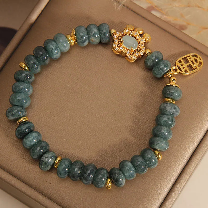 Women's bracelet with natural emerald jade abacus beads and alloy safety lock closure