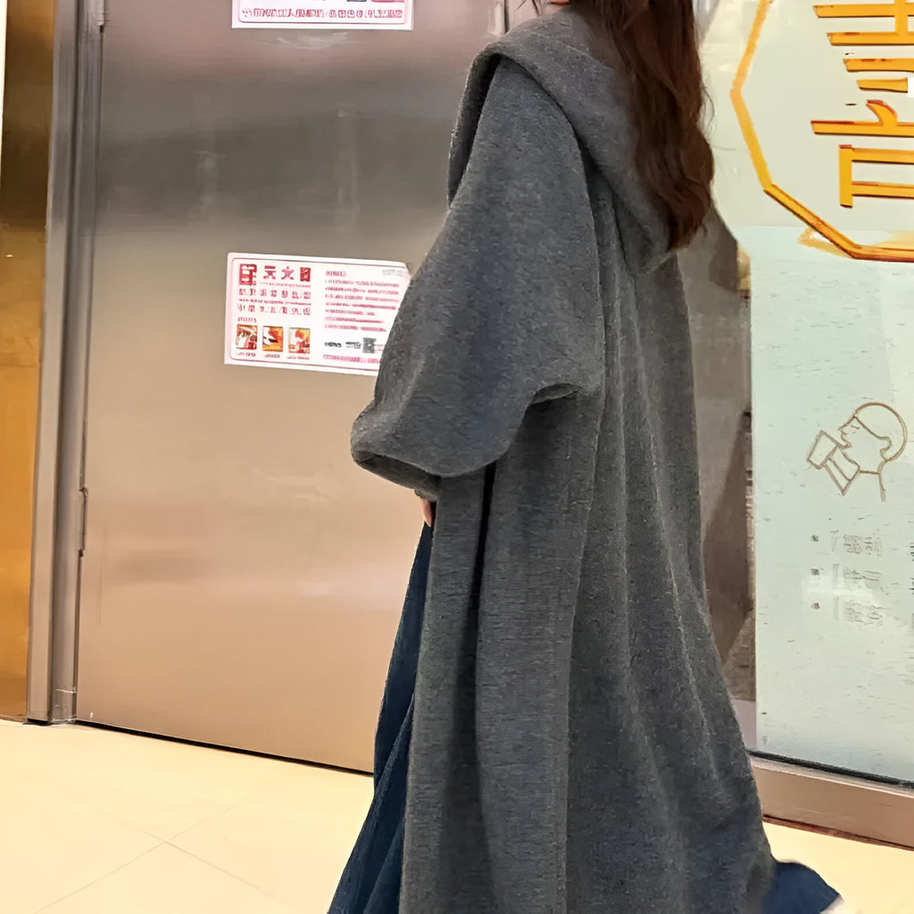 Korean style long hooded cardigan for women in oatmeal colour, showing below-the-knee length and loose fit.