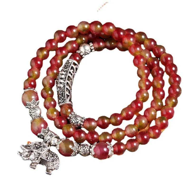 Handmade geometric bracelet made from natural watermelon crystal beads with Chinese knot closure.