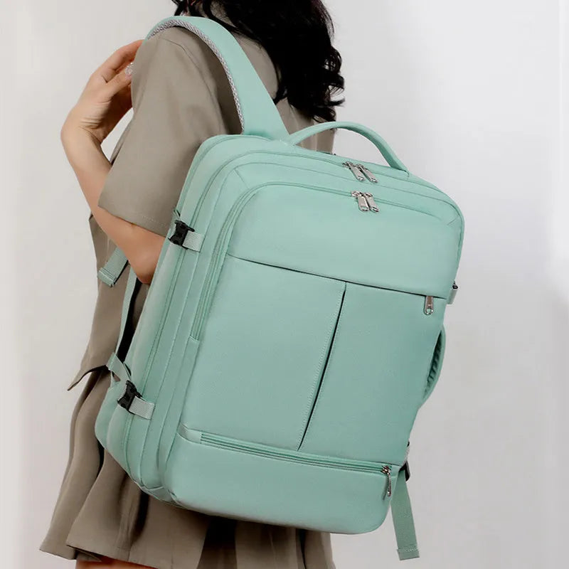 Waterproof oxford cloth backpack for a 15.6 inch laptop, shown in grey colour with multiple zippered pockets.
