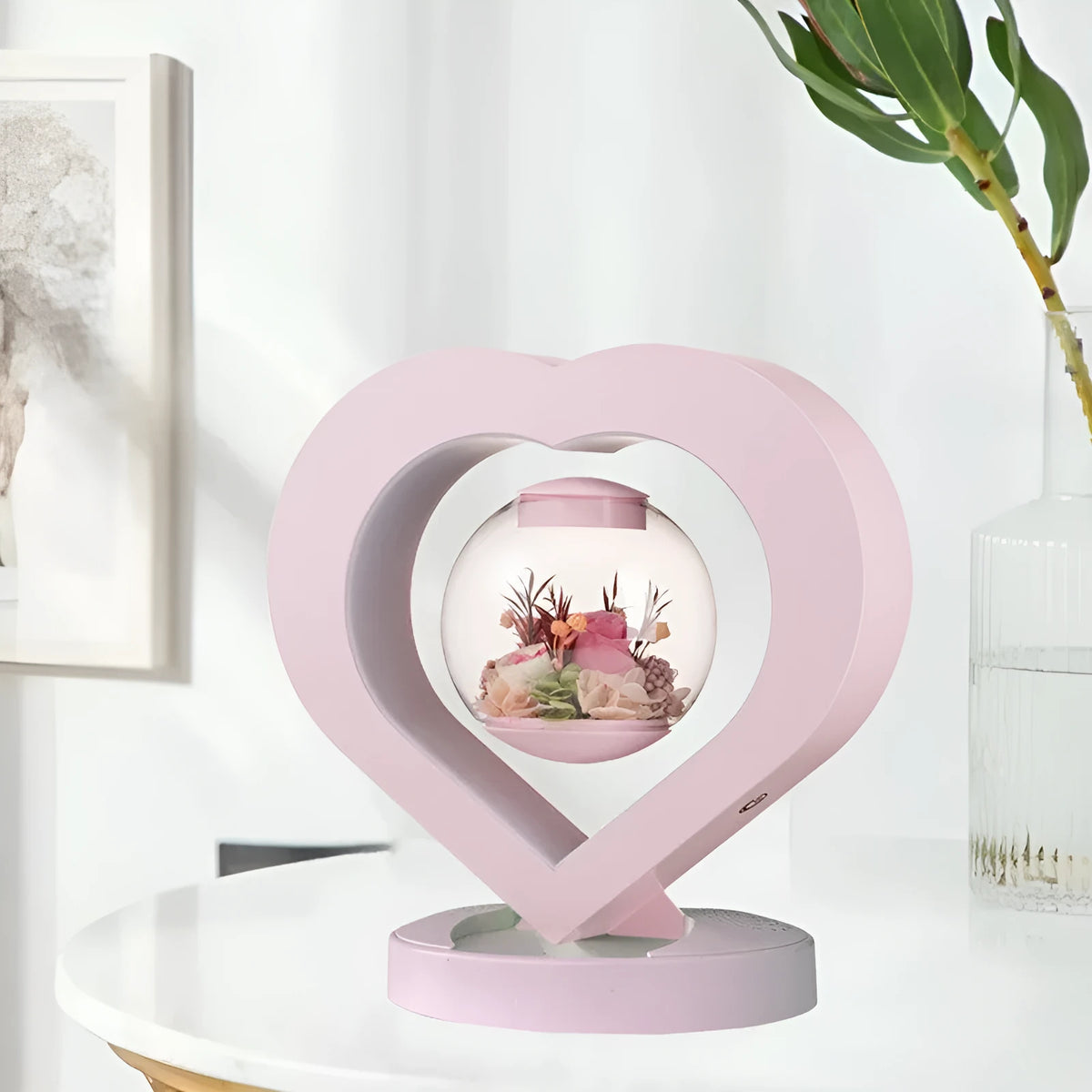 Pink preserved rose inside clear acrylic heart ornament with optional Bluetooth speaker base