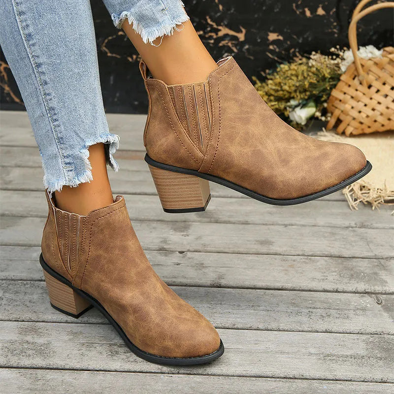 Women's black pointed toe ankle boots with thick square low heel and slip-on design
