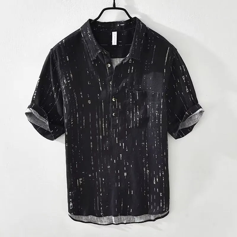 Men's loose-fit short-sleeve polo shirt cardigan in black, laid flat.