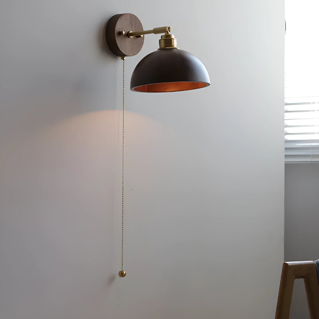 Inn Niche Nordic style wooden bedside wall lamp in walnut colour mounted on a light wall.