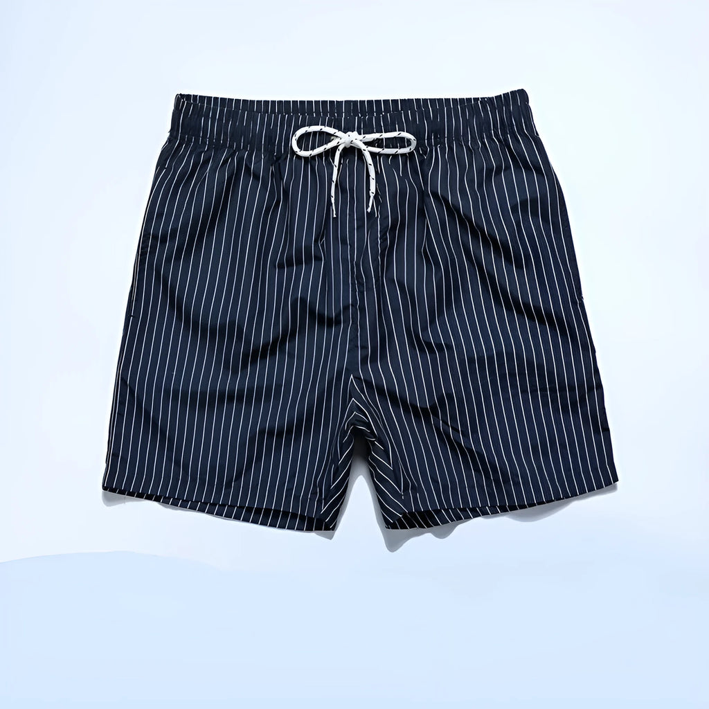 Men's striped beach shorts in navy blue, showing straight leg opening and casual fit.