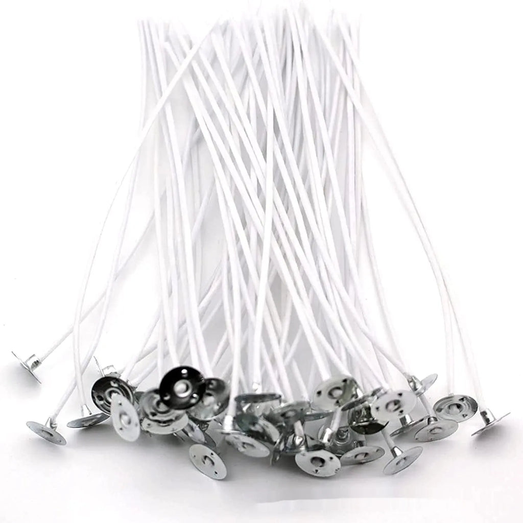 White cotton candle wicks in three lengths: 2.6cm, 6cm, and 8cm, laid out on a surface.