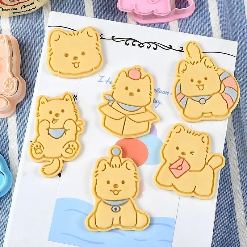 Plastic three dimensional biscuit mold with cartoon puppy designs including birthday hat style
