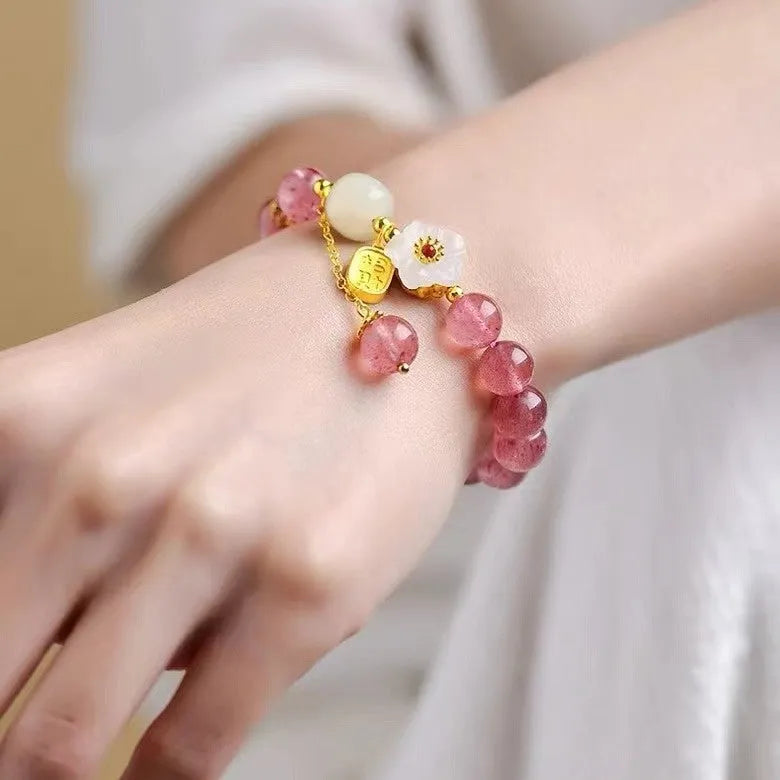 Handmade Hetian jade peach blossom strawberry quartz crystal bracelet for women showing strawberry quartz pearl and charm details