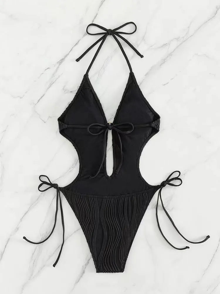 Women's black lace-up triangle bikini made from quick-dry polyester fabric.