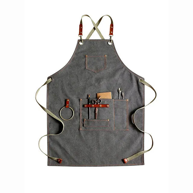 Cross-back canvas apron in camel colour with adjustable straps for café and baking work