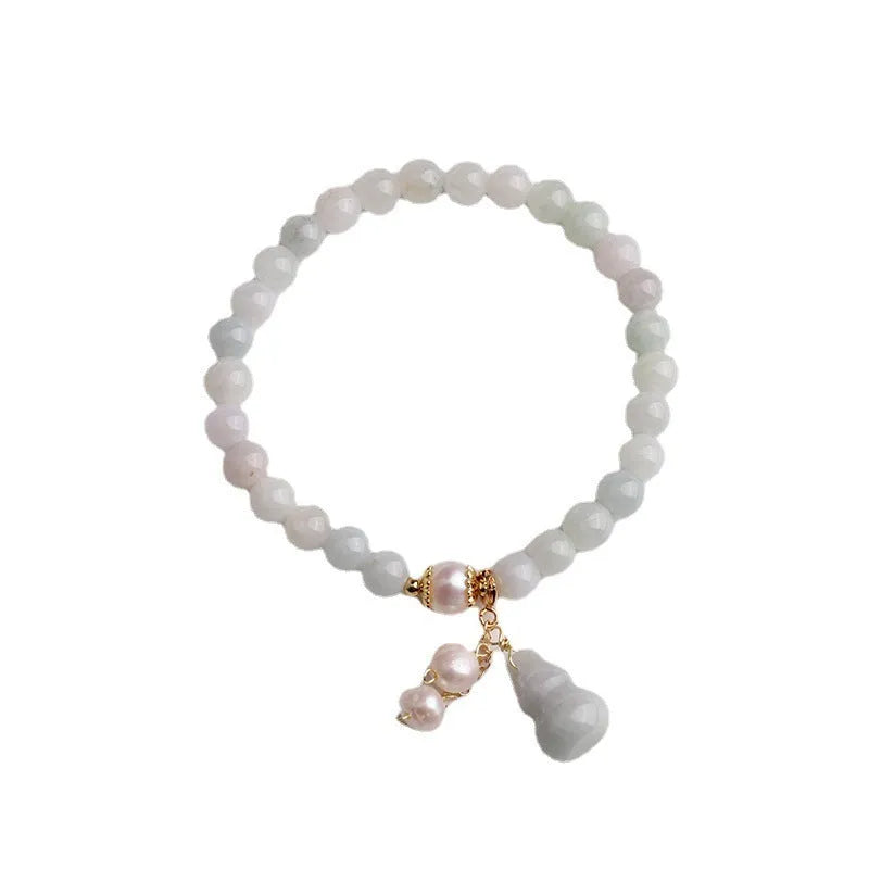 Chinese style women's jade bracelet with hand-carved emerald gourd pendant and pearl accent