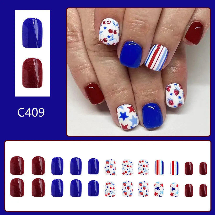 24 short glossy false nail stickers with strawberry and cherry patterns in red and blue colours