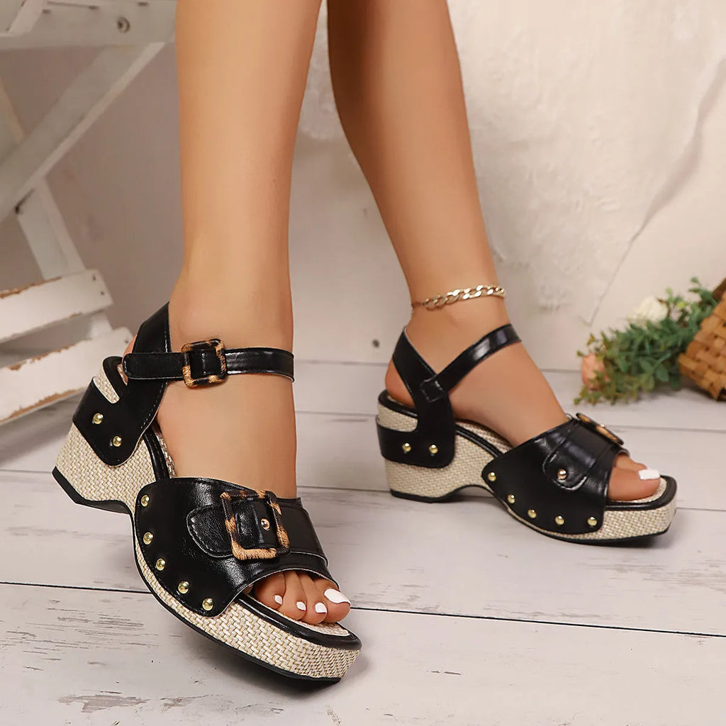 Women's black chunky heel sandals with metal buckle closure and square toe design