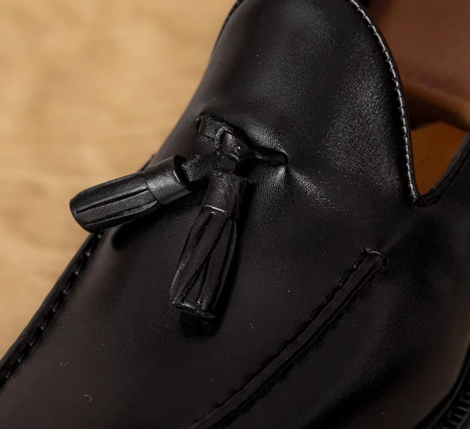 Men's black genuine leather slip-on loafers with fringed detail and rubber sole