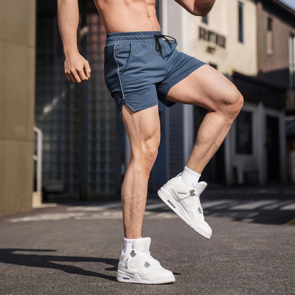 Men's straight-leg polyester sports shorts in black, shown flat.