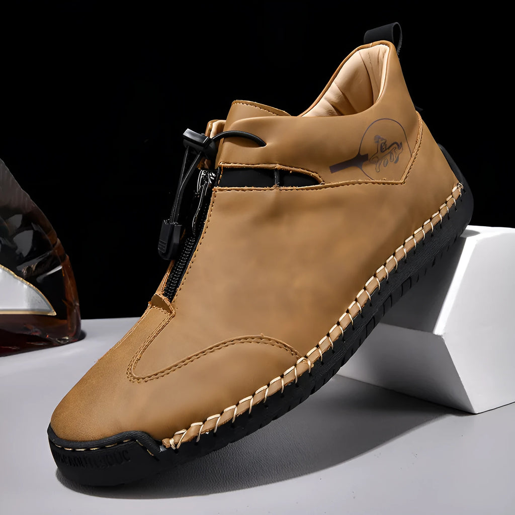 Men's black casual leather shoe with mid heel, rounded toe, and sewing thread detail on a white background.