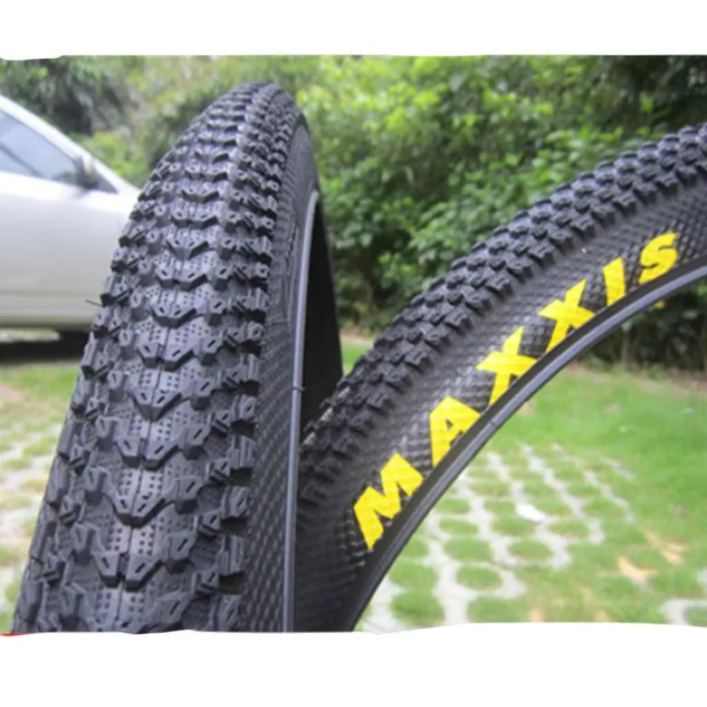 Ultralight puncture-proof mountain bike tyre showing tread pattern and available size options