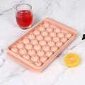 Blue silicone ice cube tray with lid showing 33 round grids, dimensions 24x14x3cm