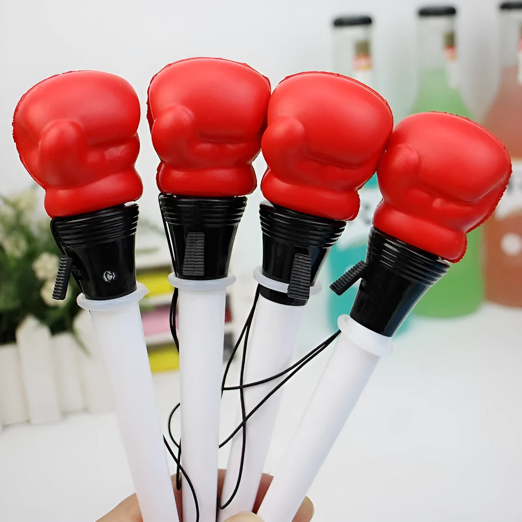 Set of four black boxing press ejection pens with bullet-shaped 0.7mm tips on a white surface.
