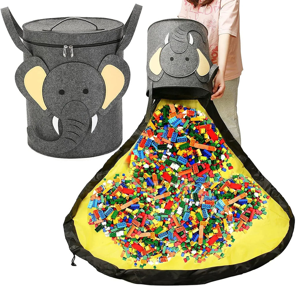 Green felt cube storage bag open showing toys inside, laying flat as play mat