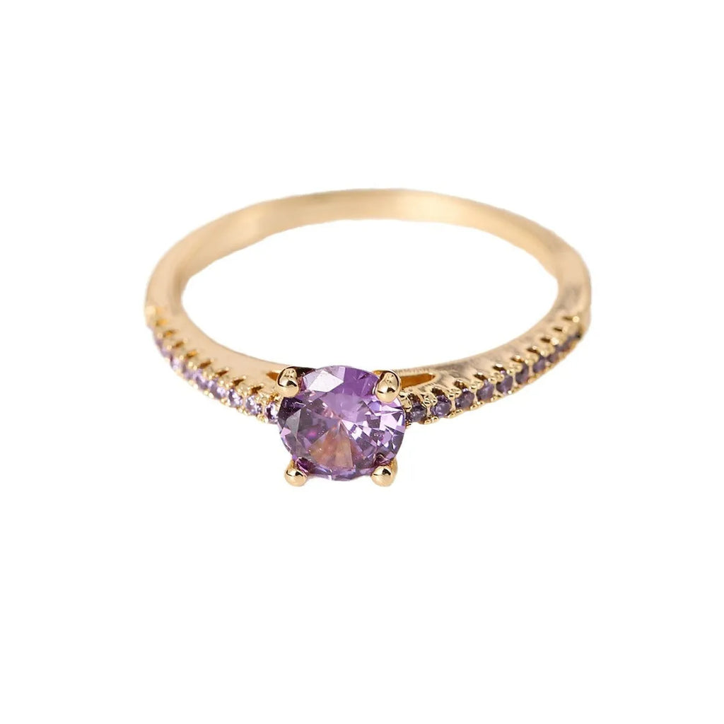 Copper hexagon geometric ring in electroplated gold rose red colour on a size 8 finger.