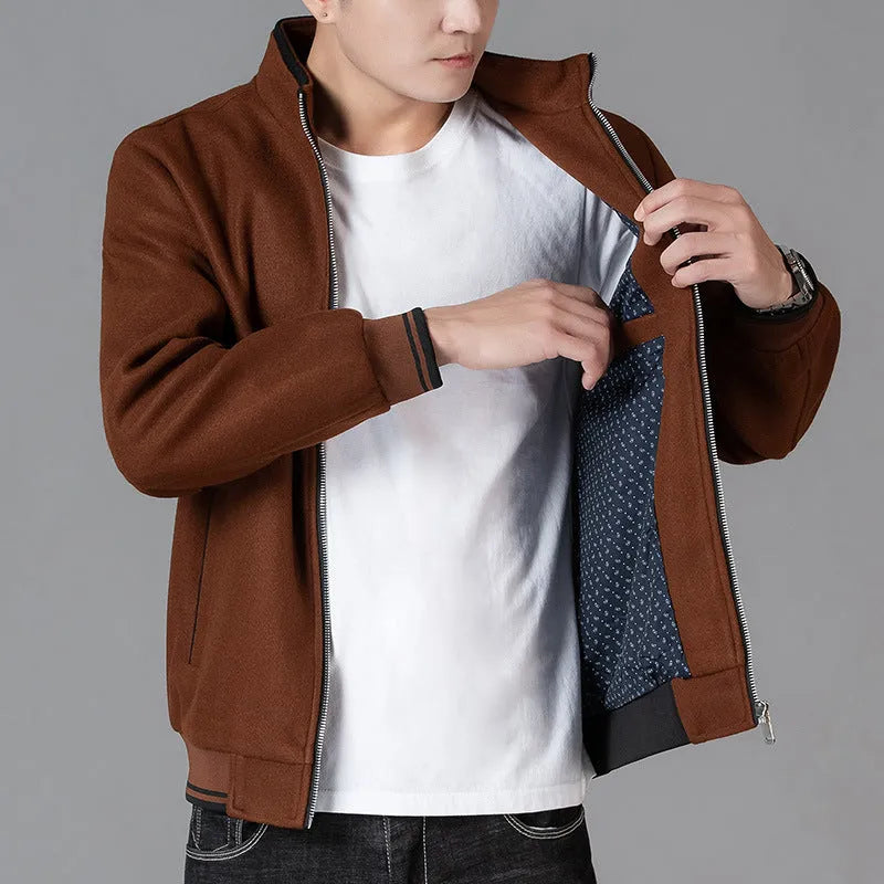 Men's grey sports-style fleece jacket with long sleeves and side pockets.