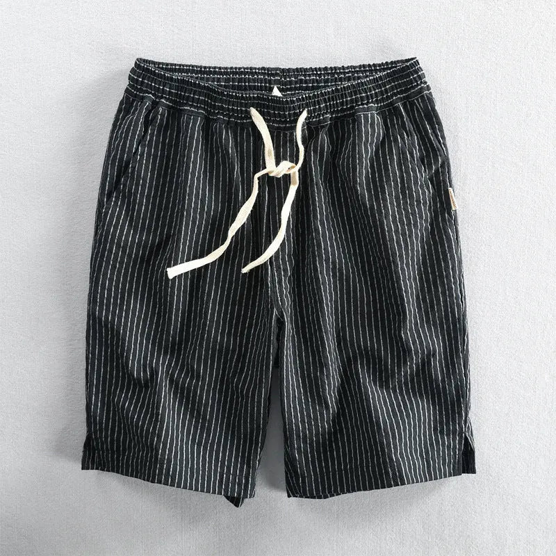 Men's striped cotton shorts in multiple colours showing loose straight cut and mid-waist design