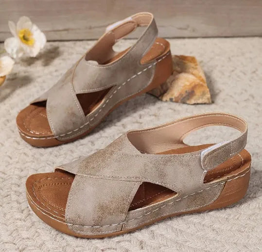 Roman platform sandals with a removable skirt and Velcro strap in a khaki colour.
