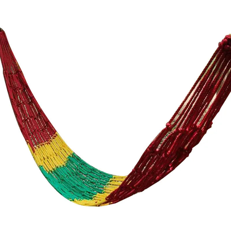 Outdoor nylon rope mesh hammock hanging between trees