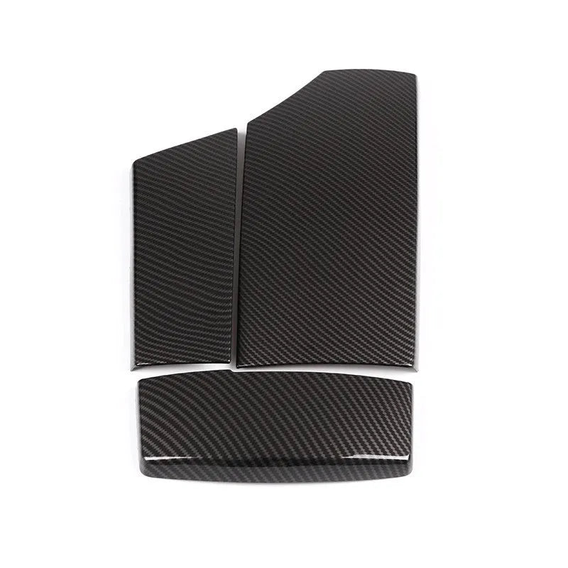 Three black ABS car armrest box covers with a glossy carbon fibre weave pattern.