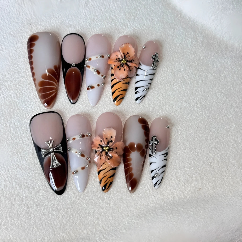 Set of 10 reusable gel nail stickers with French style leopard, cross, and flower print designs.