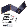 Black foldable solar panel unfolded showing three solar cells with accessories including battery clips and cables