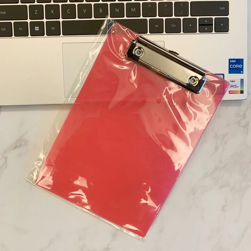 Transparent A4 plate holder with metal clip, shown in blue, acting as a writing board and document folder.