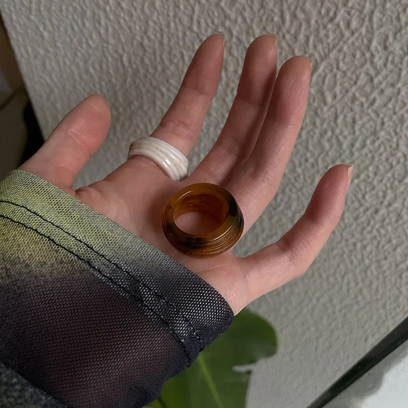 Chinese style geometric resin ring with irregular wide band design in neutral colour