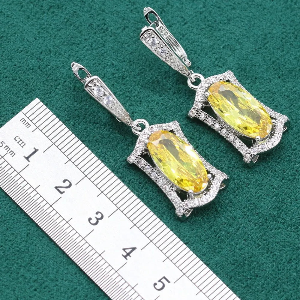 Complete zircon jewellery set with snake bone chain necklace, matching earrings, ring and bracelet in yellow or olive colour